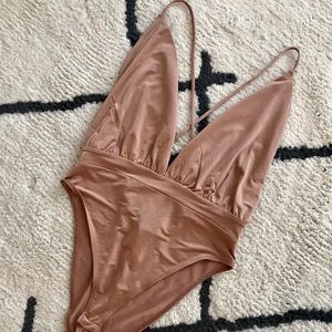 Strappy, low-cut bodysuit!